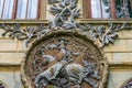 A wall sculpture illustrating a worrier who riding a horse, Sturdza castle in Miclauseni, Romania Royalty Free Stock Photo