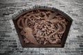 Wall Sculpture of two flying chinese swans surround with flowers Royalty Free Stock Photo