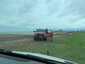 A tow truck winching out a RV Sprinter Van stuck in the mud in the Wall, SD boondocking spot in Badlands National Park Royalty Free Stock Photo