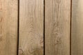 several vertical old wooden boards with gaps
