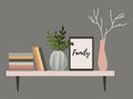 Wall shelf for a Scandinavian-style living room interior with flower pots, vase with a branch, books and paintings Royalty Free Stock Photo