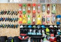 On wall of showcase - hang goods for travelers and tourists - safety harnesses, ropes, carabiners