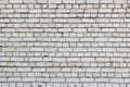 A wall of small gray bricks. The texture of the brickwork.