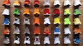 A wall of sneakers in various colors and styles are displayed in a shoe store Royalty Free Stock Photo