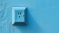 Wall socket on blue wall. Generative AI Royalty Free Stock Photo