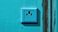 Wall socket on blue wall. Generative AI Royalty Free Stock Photo