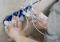 Wall socket installation.Work on installing electrical outlets. Electrician prepares the wiring fitting outlets. Royalty Free Stock Photo