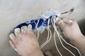 Wall socket installation.Work on installing electrical outlets. Electrician prepares the wiring fitting outlets. Royalty Free Stock Photo