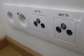 Wall socket made of two power sockets and two television signal sockets Royalty Free Stock Photo