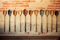 A wall with spoons hanging on it, AI Royalty Free Stock Photo