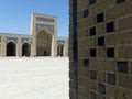 Wall with square of colored ceramics in an ancient religious building to Bukhara in Uzbekistan.