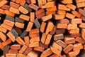 Wall of stacked red clay bricks for construction site Royalty Free Stock Photo