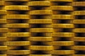 A wall of stacks of Russian coins of 10 rubles. Background or wallpaper with low contrast. Economics and banks of Russia. News
