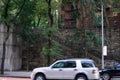 wall with steps next to the street with passing by blurry cars Royalty Free Stock Photo