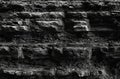 Wall stone texture natural. uneven canyon gorge with protrusions pattern geology dark