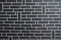 Wall stones dark grey black brick stone wall fine brickwork background texture