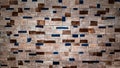 Wall of stove or fireplace lined with multi-colored heat-resistant tiles. Stone texture or background. Mosaic