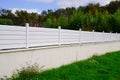 Wall street aluminium white fence barrier around private house protect view home garden Royalty Free Stock Photo