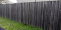 Wall street wooden brut fence barrier around private house protect raw view home garden Royalty Free Stock Photo