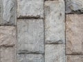 Wall texture made of large vertical stone blocks. Royalty Free Stock Photo