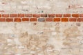 Wall texture with plaster and exposed antique red bricks Royalty Free Stock Photo
