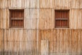 Wall of a thatched house with windows Royalty Free Stock Photo