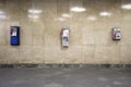 Wall with three telephones