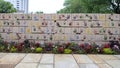 Wall of tiles made by children, Front of the Oklahoma City National Memorial & Museum, with flowers in foreground