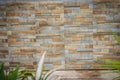 Wall tiles patterned like natural split stone background. Simulated yellow natural stone facade, wall tiles texture.