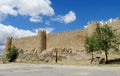 Wall, tower and bastion of Avila, Spain, made of yellow stone bricks Royalty Free Stock Photo