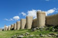 Wall, tower and bastion of Avila, Spain, made of yellow stone bricks Royalty Free Stock Photo