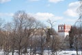 The wall and tower of the Novodevichy Convent behind a frozen pond and bare trees, Moscow, 2021 Royalty Free Stock Photo