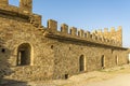 The wall and tower of a real medieval castle. Fortress wall of large stone. Fortress Soldaia in Sudak.