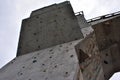 Wall for training rock climbing, close up detail, gray rainy cloudy sky