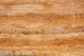 Wall of travertine with stone layers of different colors. Close up architecture macro photography. Creative wallpaper Royalty Free Stock Photo