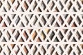Wall with triangles of different materials in white frames Royalty Free Stock Photo