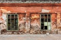 Wall with two broken windows of abandoned building in Mariupol Royalty Free Stock Photo