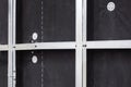 A wall under construction with metal studs and a black membrane, prepared for insulation. Royalty Free Stock Photo