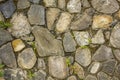 Wall of various large natural stones with small green vegetation. wall with moss. rough wall surface texture. gray, blue and white Royalty Free Stock Photo