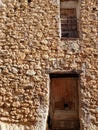 Wall of rocks with two old doors