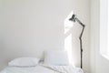 Wall white bedroom bed, pillow and fresh linens. Royalty Free Stock Photo