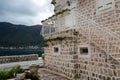 Wall white stone house standing next to the promenade Royalty Free Stock Photo