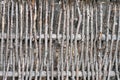 Wall of willow twigs as background. Rural old fence, made from willow tree twigs and branches Royalty Free Stock Photo