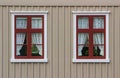 Wall with windows and curtains Royalty Free Stock Photo