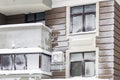 Wall with windows of modern high-rise apartment building covered with snow and frost after heavy windy snowstorm Snowfall and Royalty Free Stock Photo