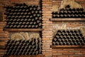 A wall of wine bottles with a brick background Royalty Free Stock Photo