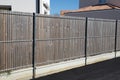 wall wooden and steel fence street wood barrier modern house protect view home garden Royalty Free Stock Photo