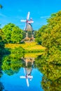 Wallanlagen with Am Wall Windmill and colorful flowers foreground in Bremen, Germany Royalty Free Stock Photo