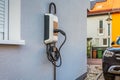 Wallbox on a family house wall for comfortable charging of electric car Royalty Free Stock Photo
