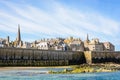 The walled city of Saint-Malo in Brittany, France, seen from the beach by a sunny morning